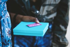 person-holding-blue-box-1229180