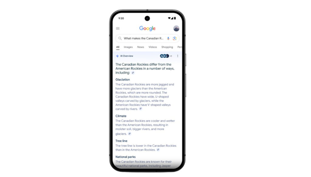 Egy okostelefon megjeleníti a Google keresési eredményeit a „Mitől különbözik a kanadai sziklák?” kérdésre. Rávilágít az eljegesedés, az éghajlat és a fasorok közötti különbségekre. A Google több európai piacra is kiterjeszti az AI Overviews funkciót.
